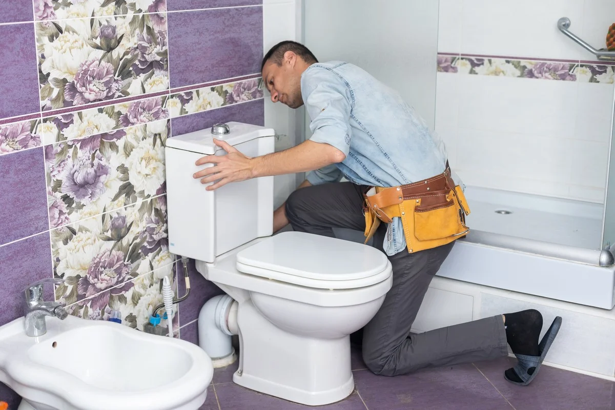 Plumber explaining plumbing repair options to a homeowner